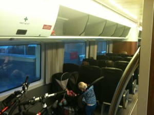 a child on a bicycle in a train
