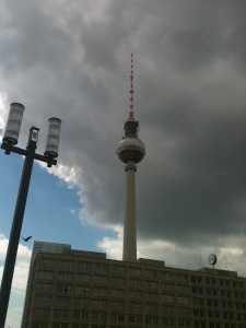 a tall tower with Fernsehturm Berlin in the background