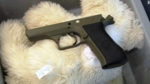 a gun on a white fur