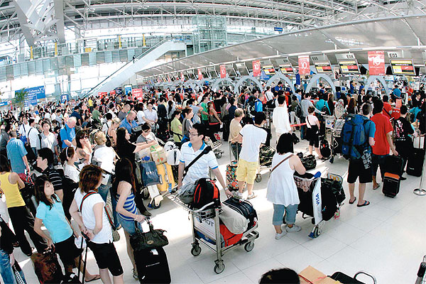 a crowd of people at an airport