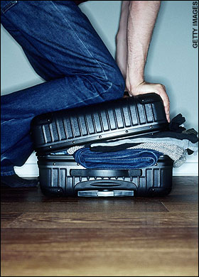 a person's legs and legs in jeans and a suitcase
