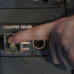 a finger pressing a switch on a device