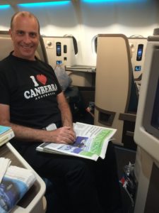 a man sitting in a chair with a newspaper