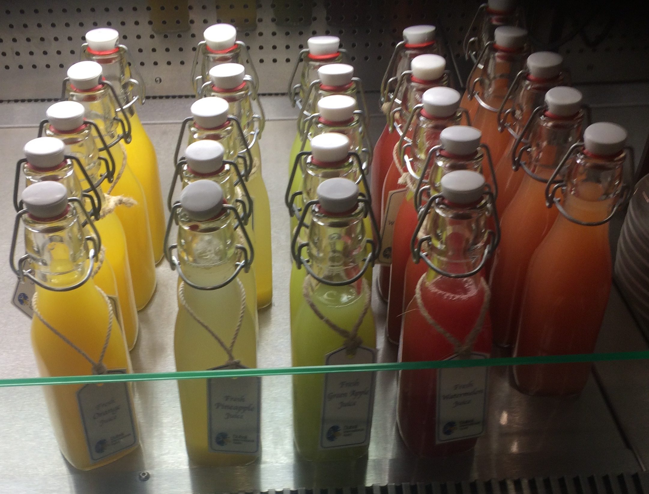 a group of bottles of juice