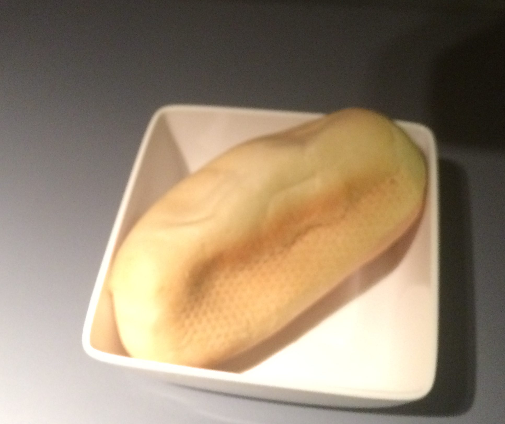 a loaf of bread on a white plate