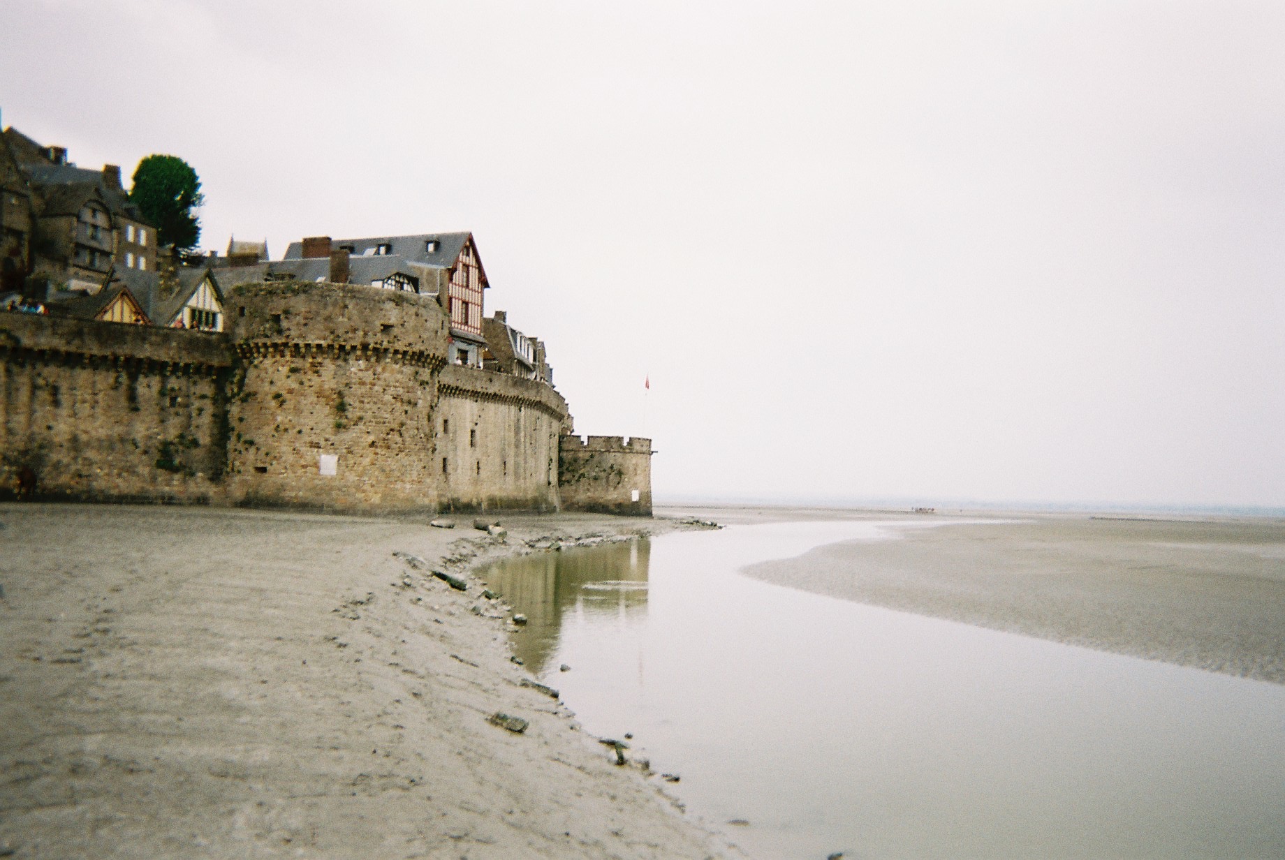 a stone castle on a beach