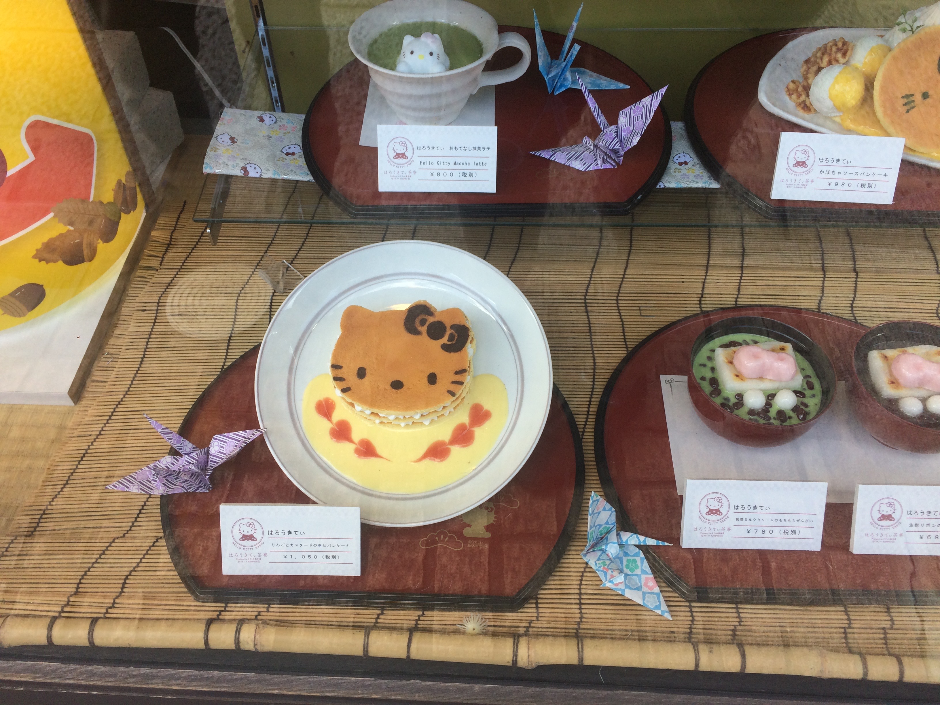 a display case with food on plates