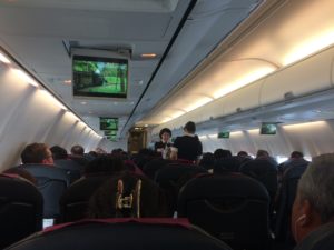 a group of people sitting in an airplane