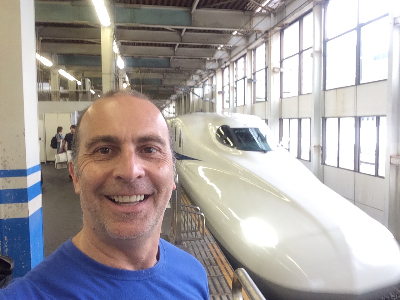 a man taking a selfie in a train station