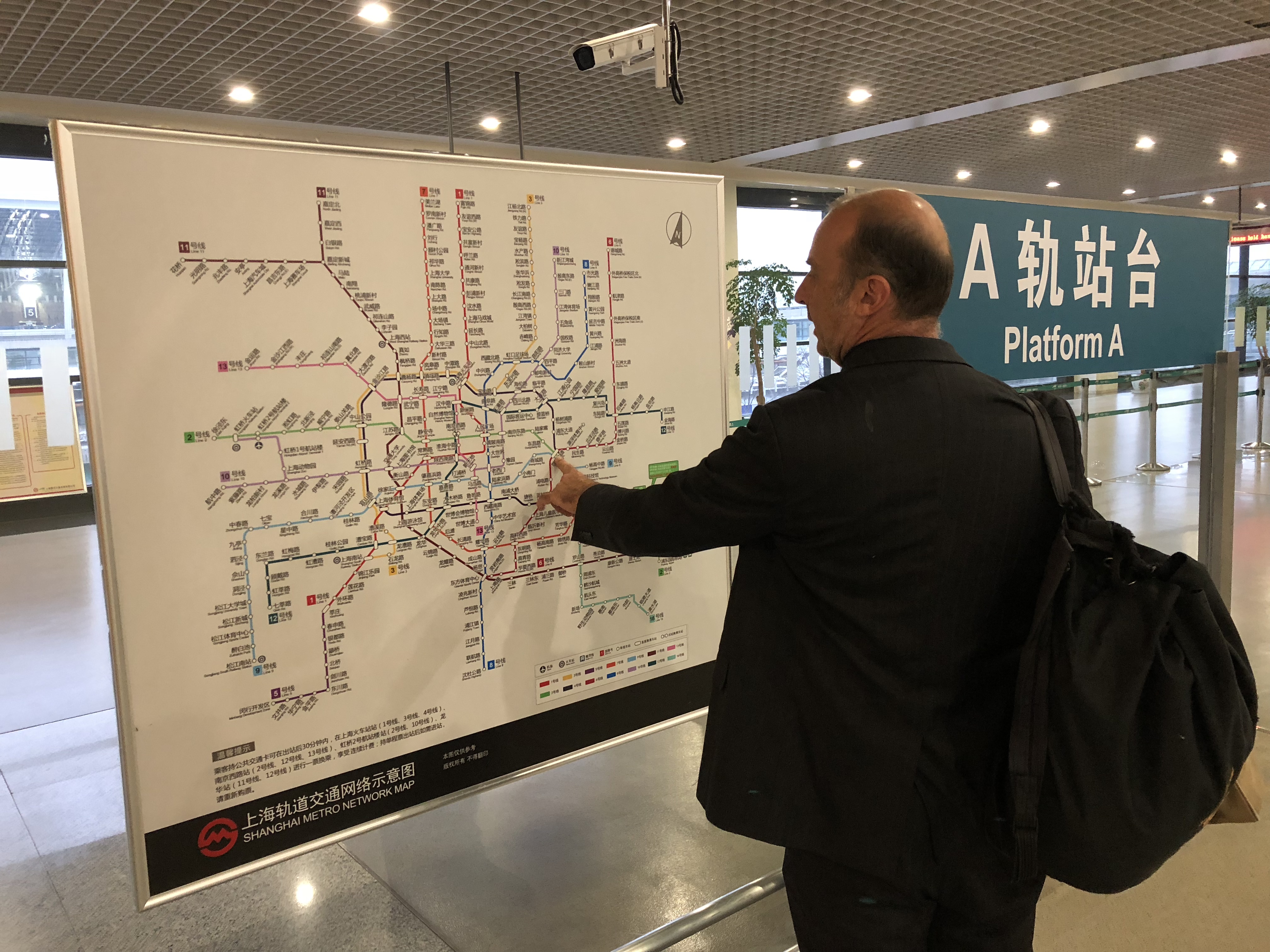 a man pointing at a map
