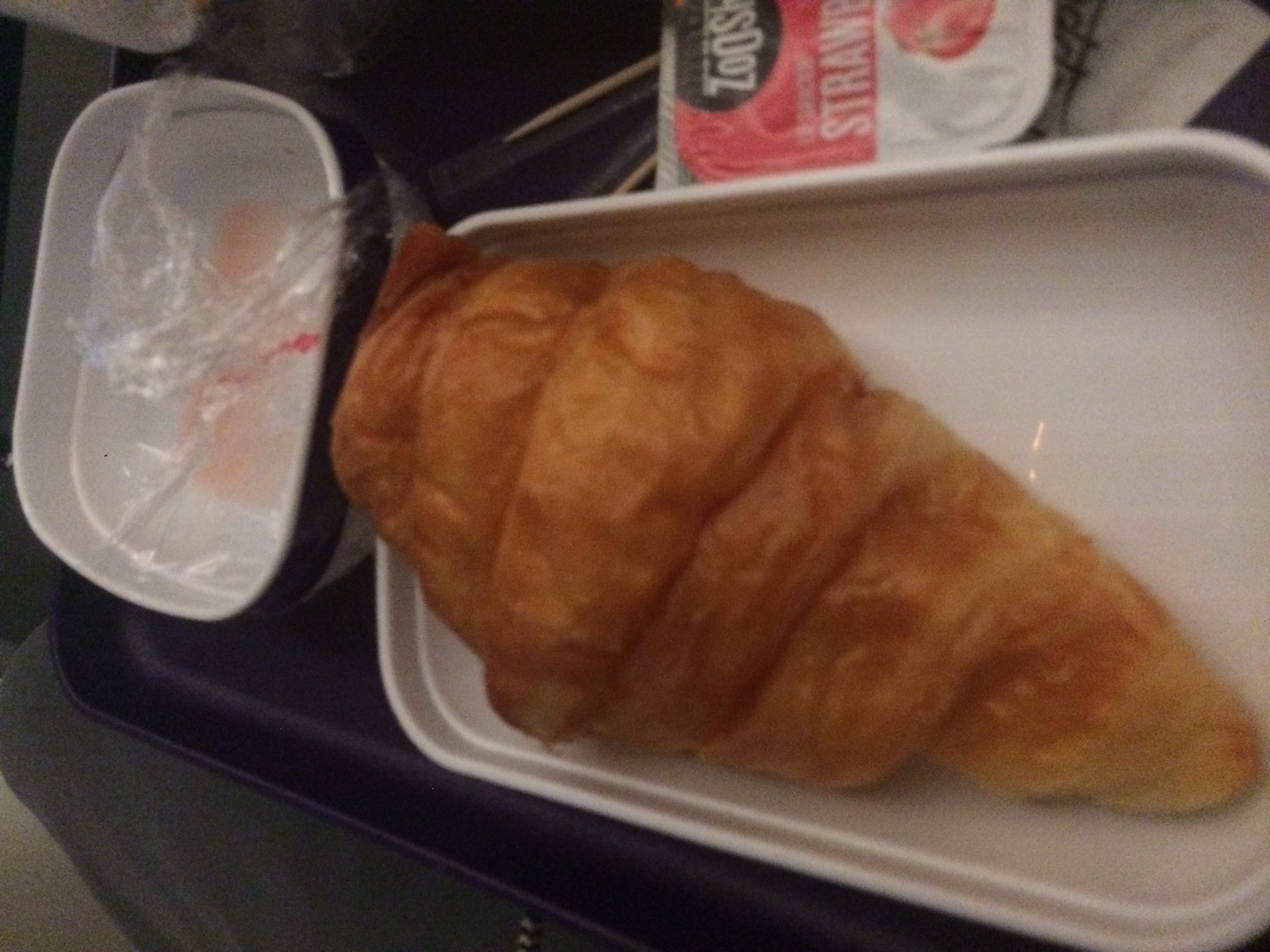 a croissant on a tray