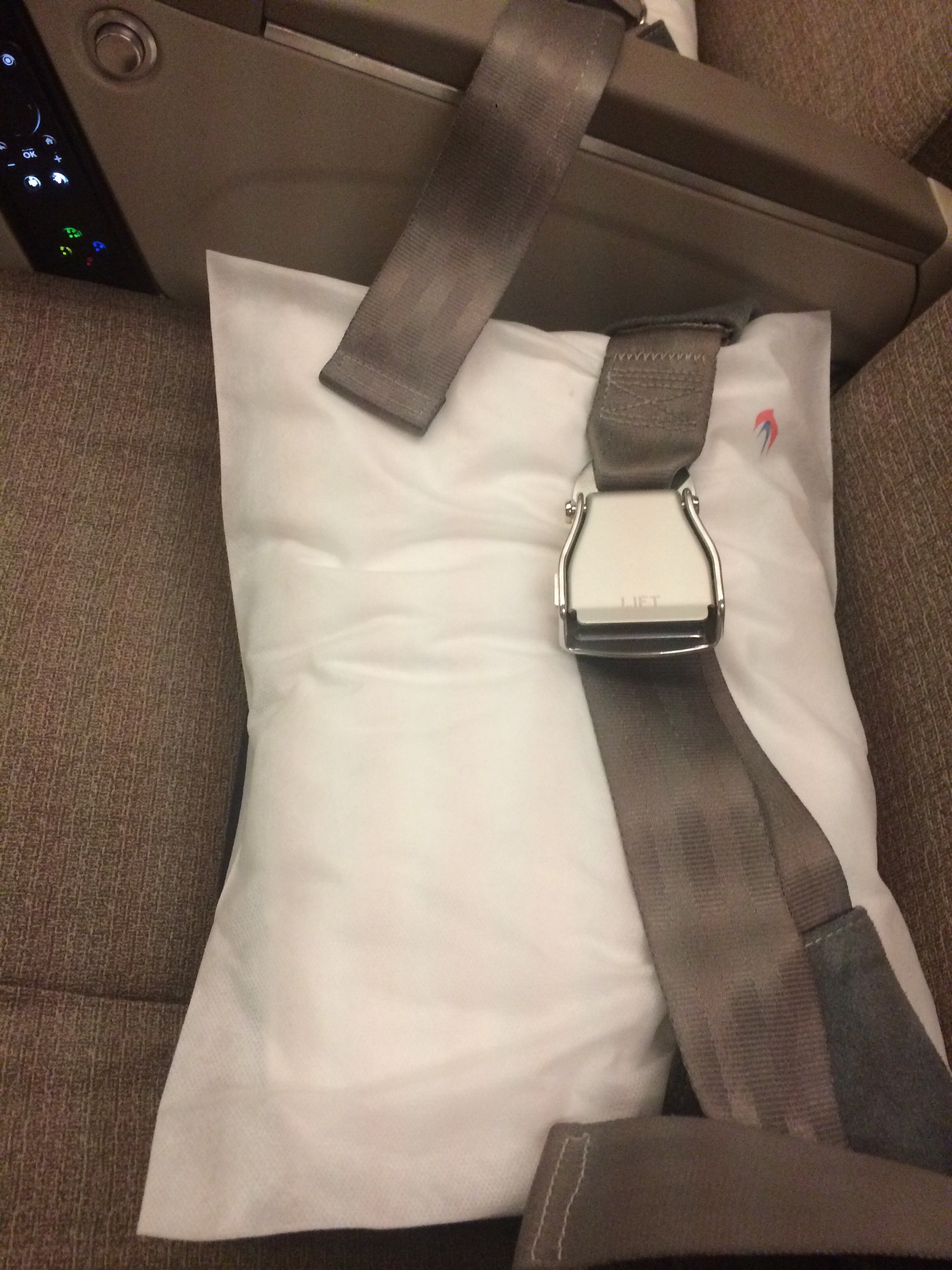 a seat belt on a pillow