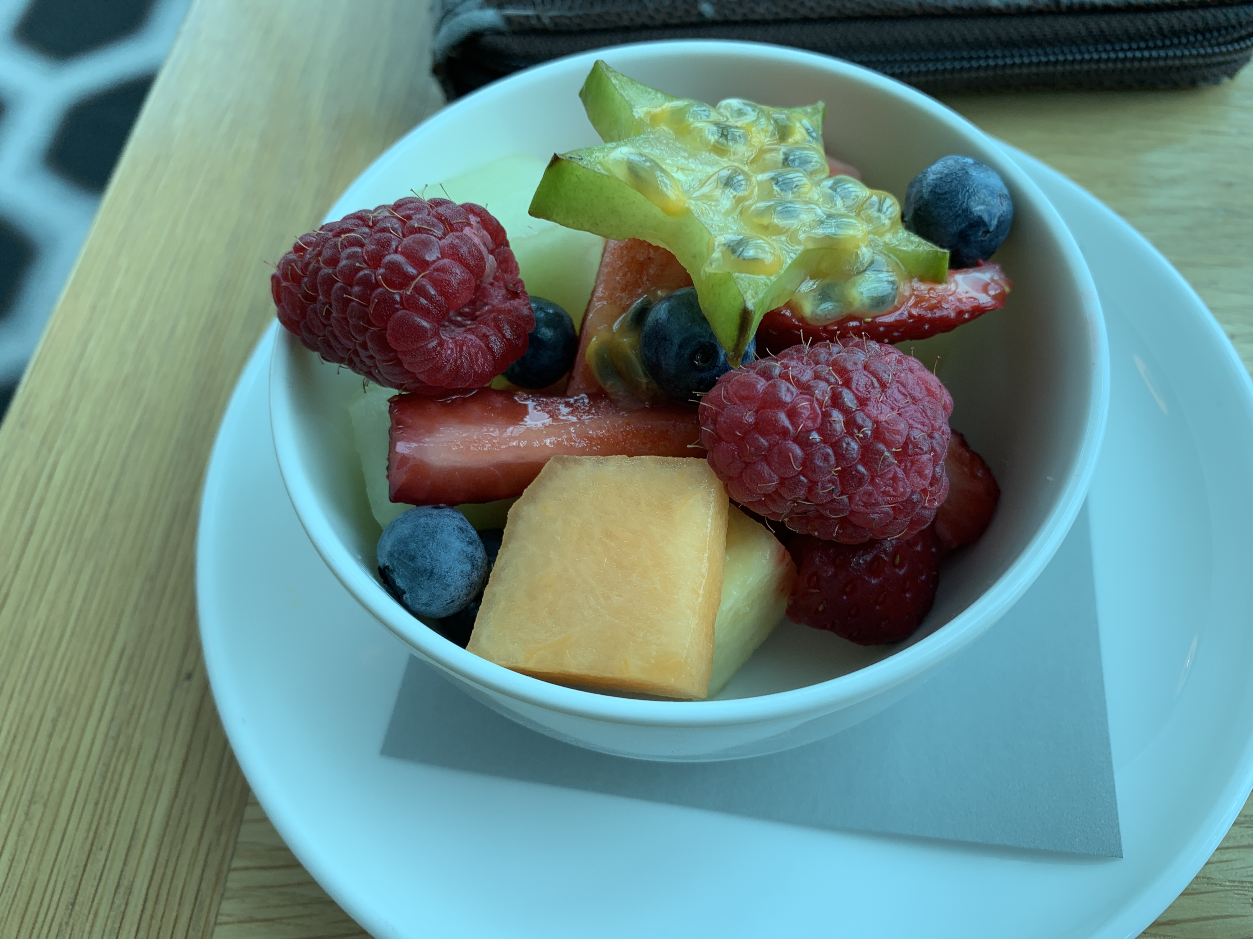 a bowl of fruit on a plate