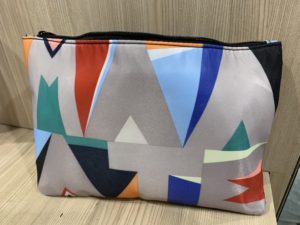 a colorful bag on a wood surface