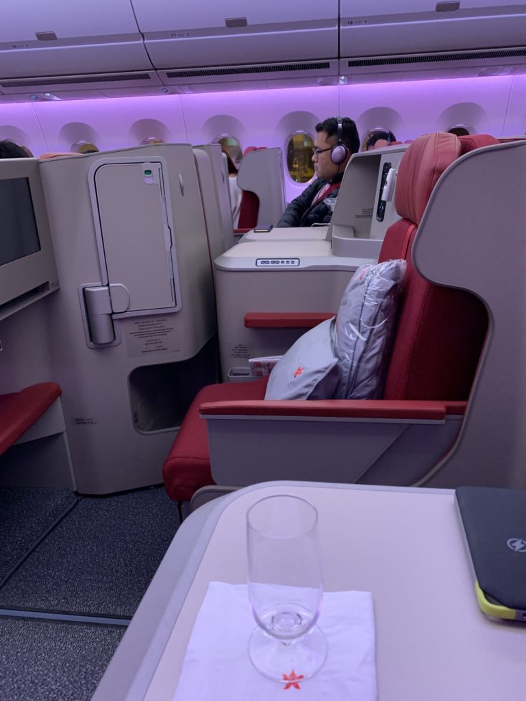 a person sitting in a chair in a plane