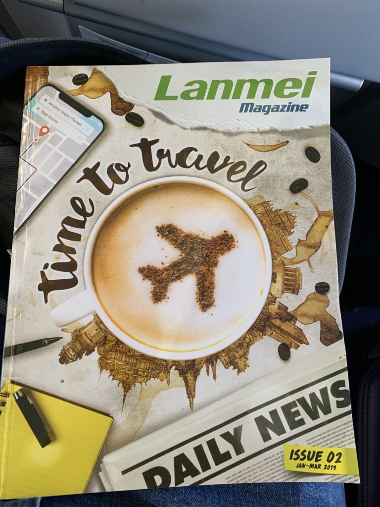 a magazine with a picture of a coffee cup and a plane on it