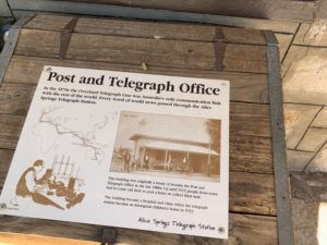 a sign on a wood surface