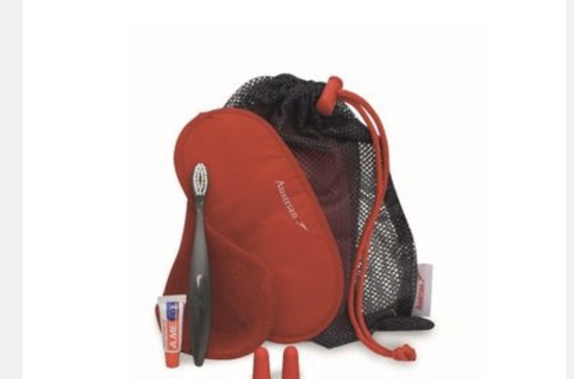 a red bag with a toothbrush and a toothpaste