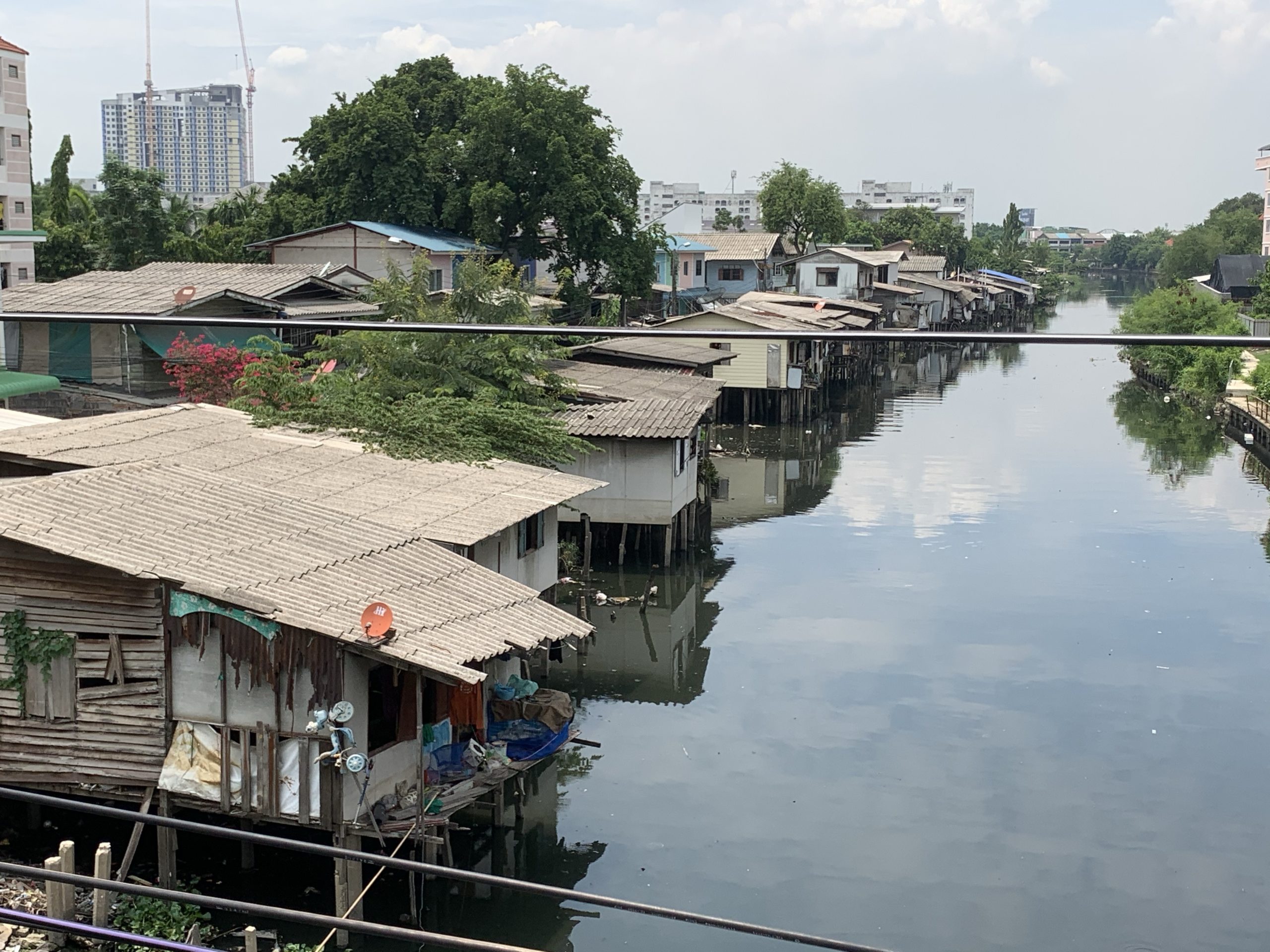 a group of houses on stilts on water