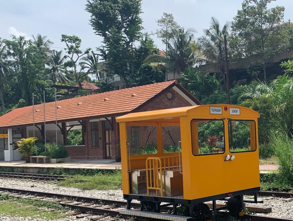 a yellow train on tracks