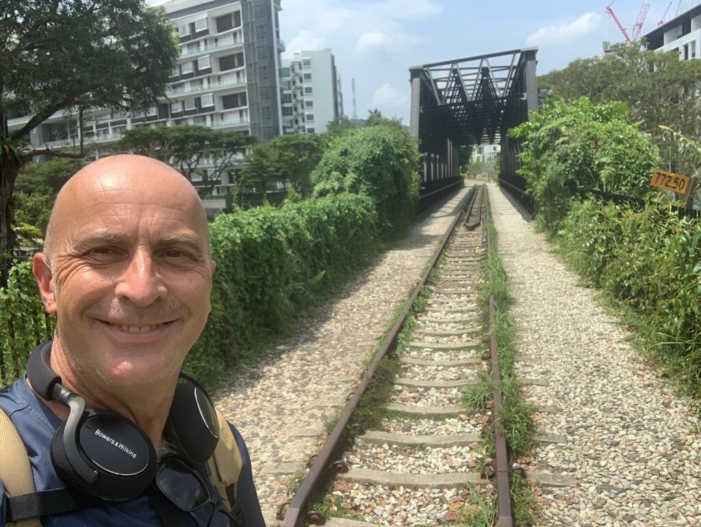 a man taking a selfie on train tracks