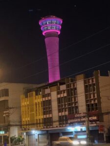 a tower with a purple light