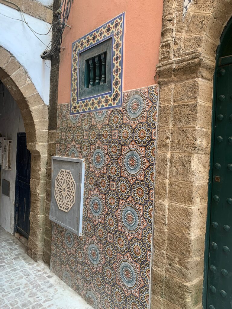 a wall with colorful tiles on it