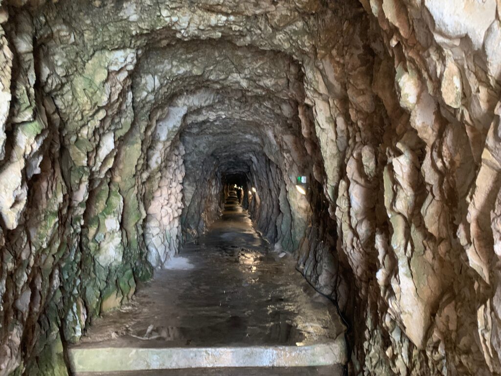 a stone tunnel with water running through it