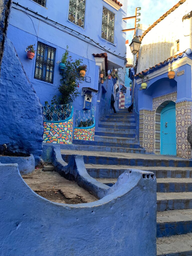 a blue painted stairs in a city