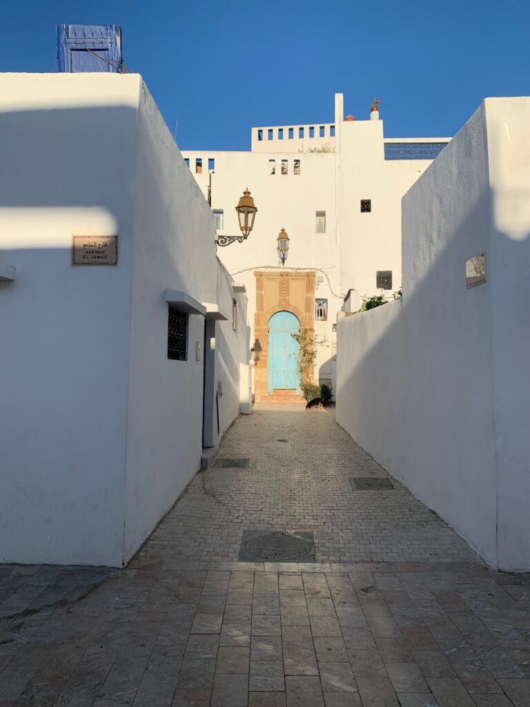a white building with a blue door