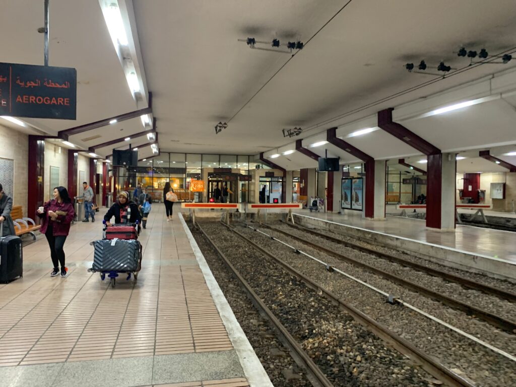 people walking in a train station