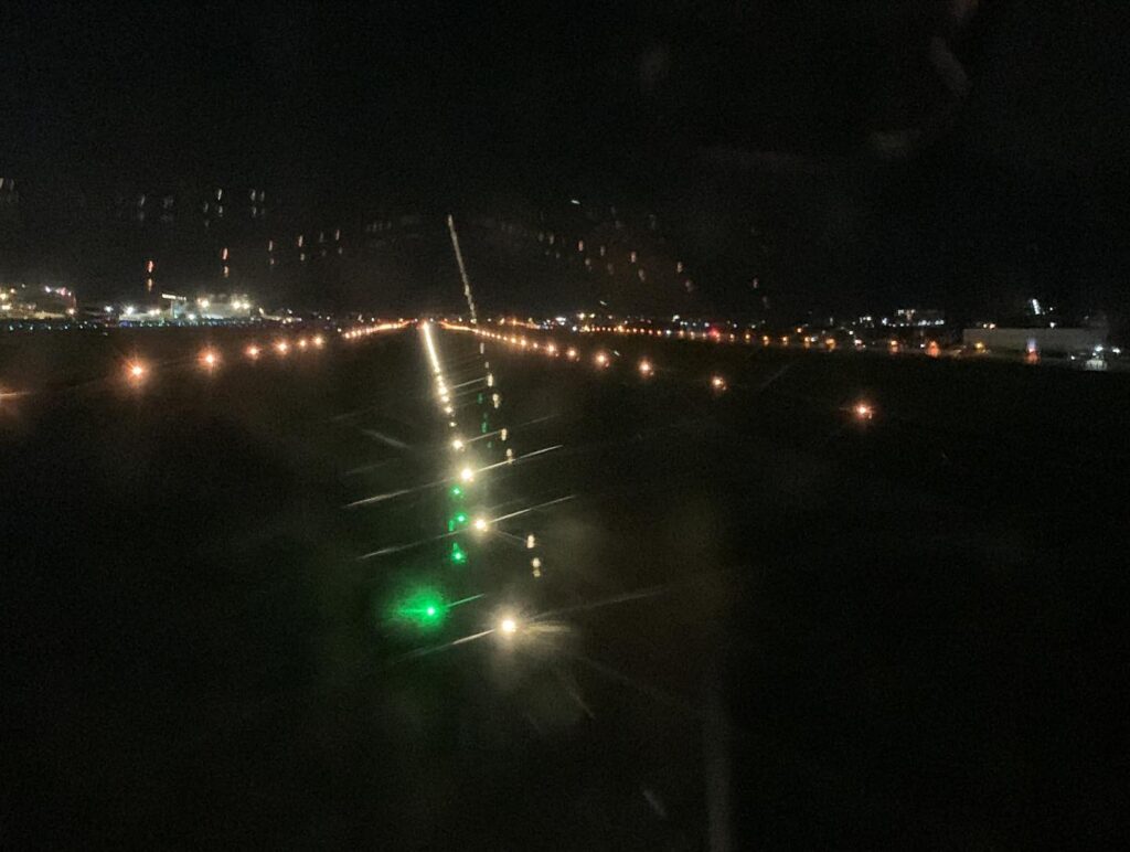 a runway at night with lights