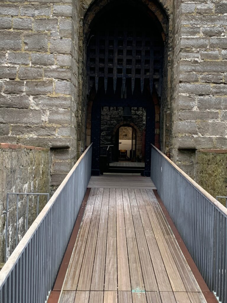 a walkway leading to a stone building