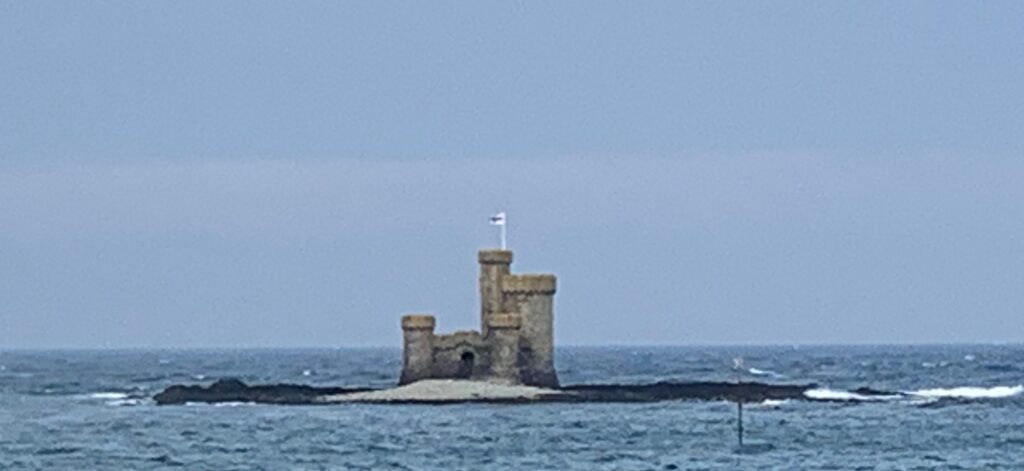 a castle on a small island in the ocean