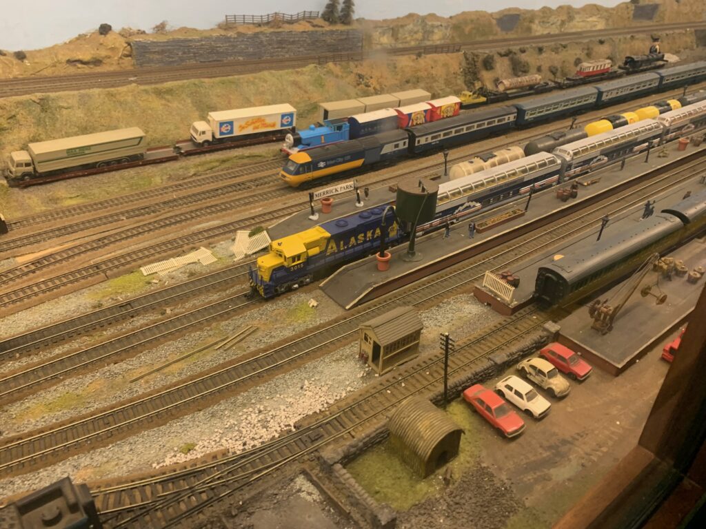a model train tracks with cars and trains
