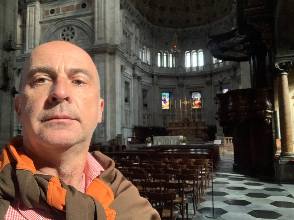 a man taking a selfie in a church