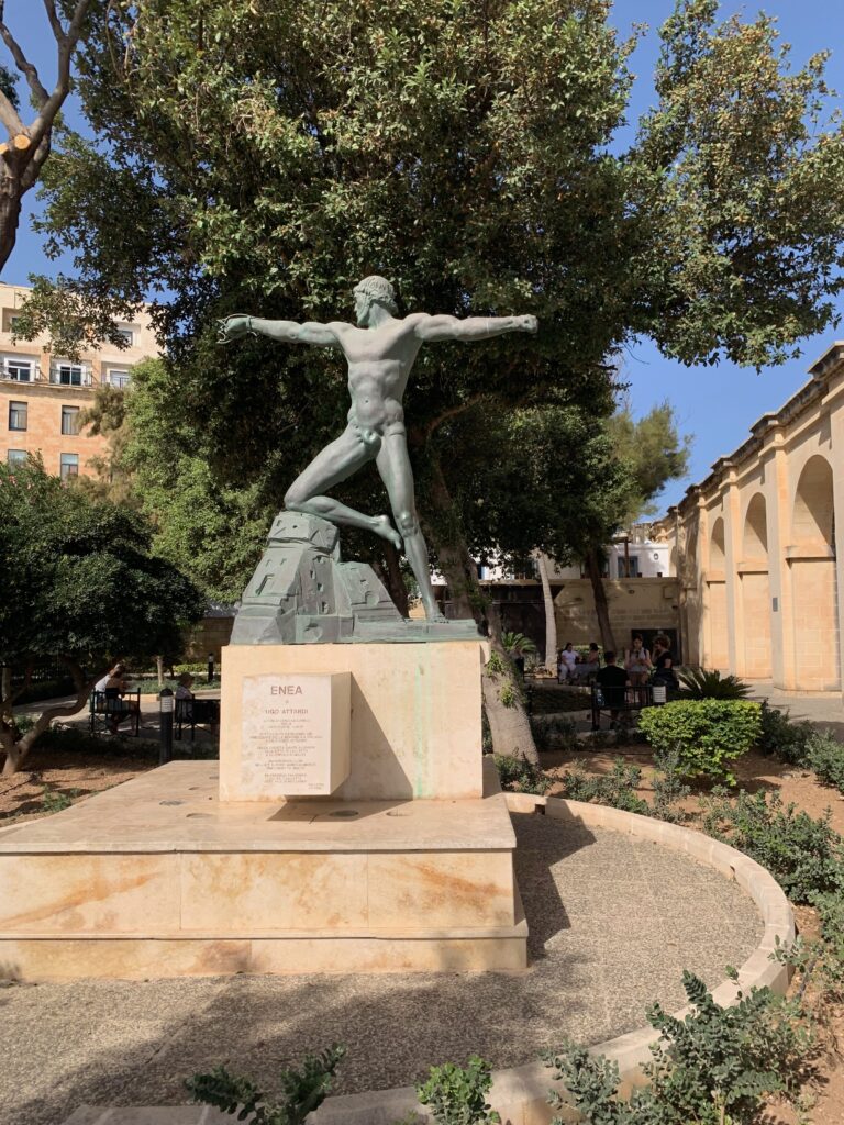 a statue of a man with arms outstretched