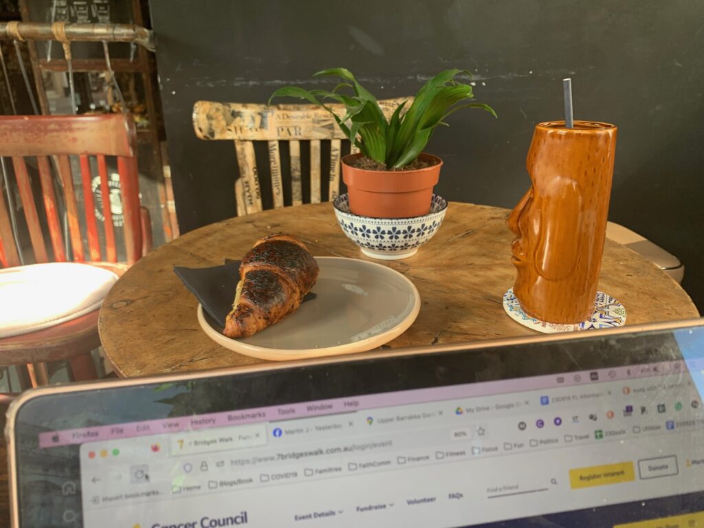 a croissant and a plant on a table