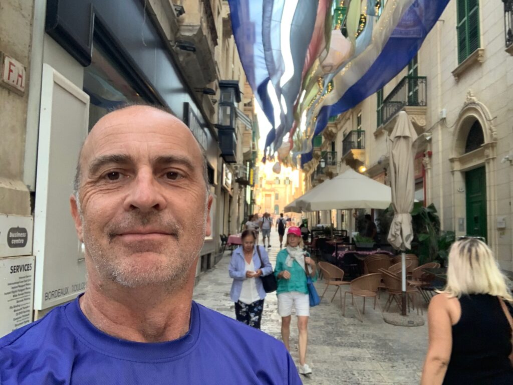 a man taking a selfie in a street