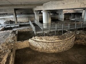 a stone walls and walkways in a building