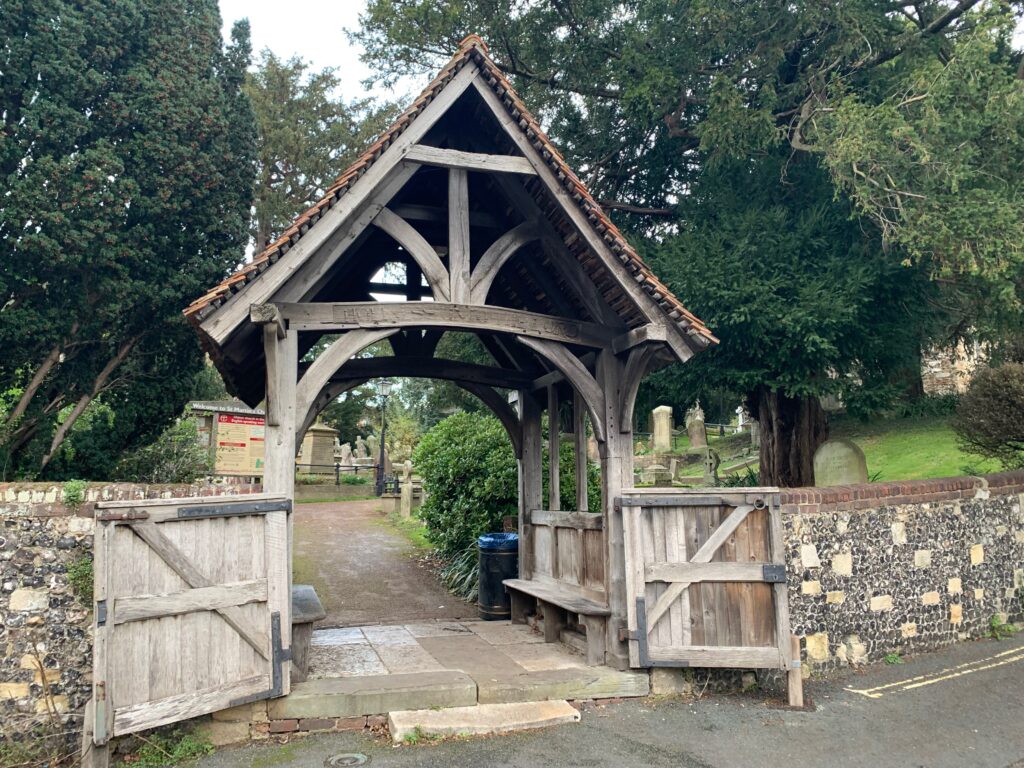 a wooden gate with a wooden roof