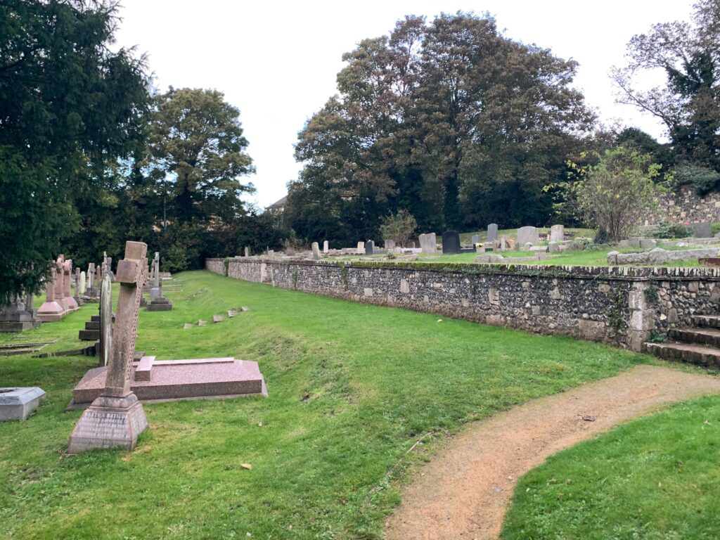 a cemetery with grass and trees