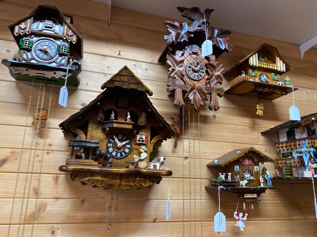 a group of cuckoo clocks on a wall