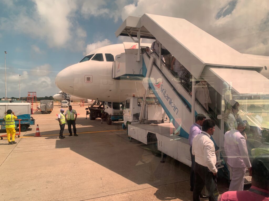 people boarding a plane at an airport