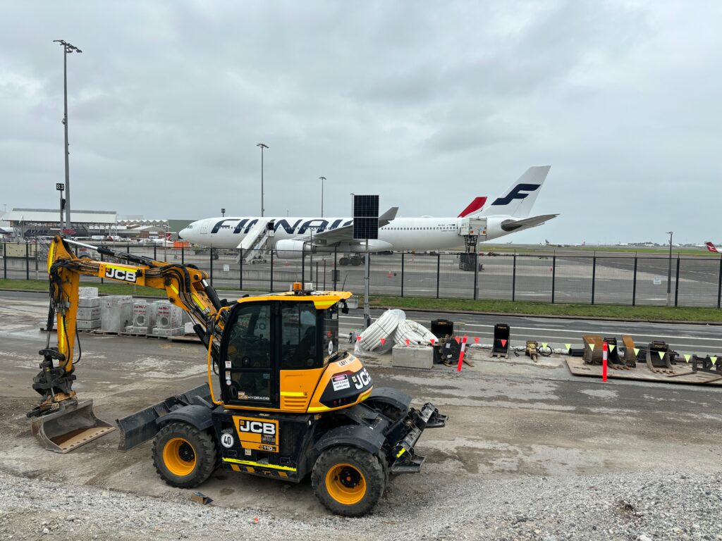 a construction vehicle parked on a runway