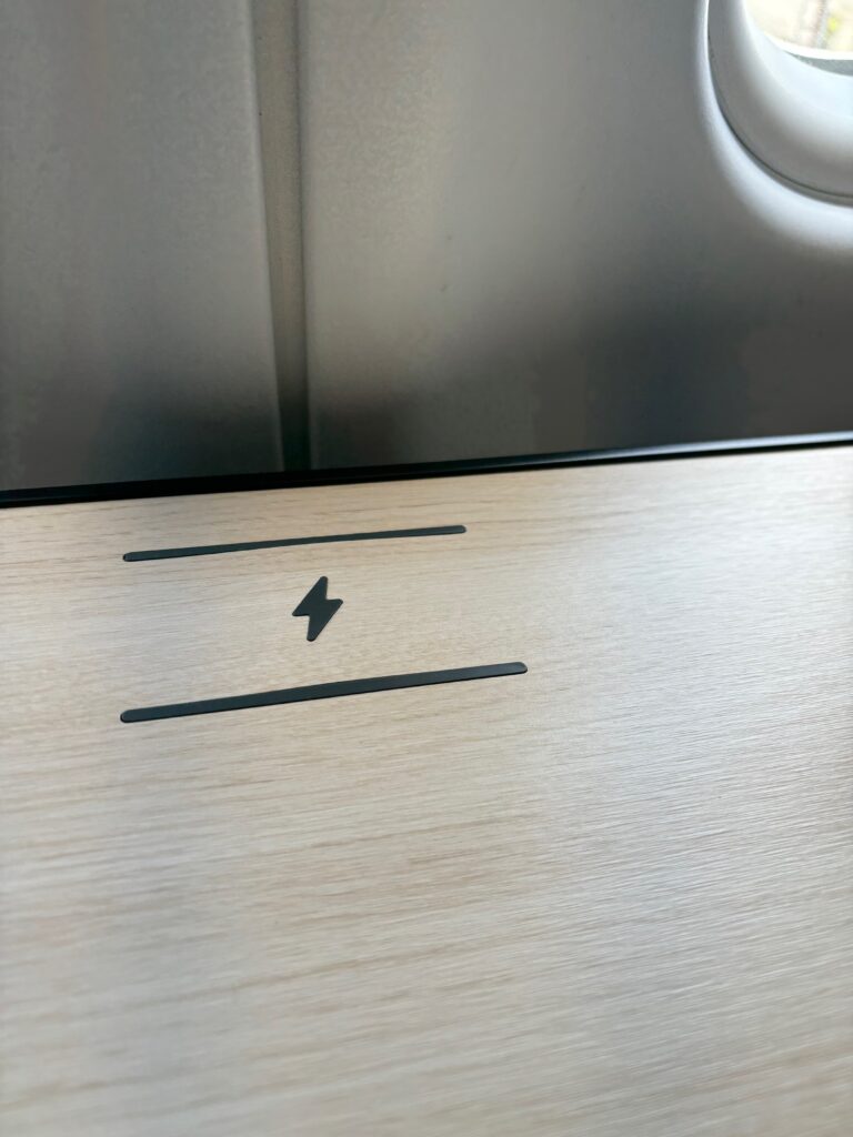 a black lightning bolt on a wood surface