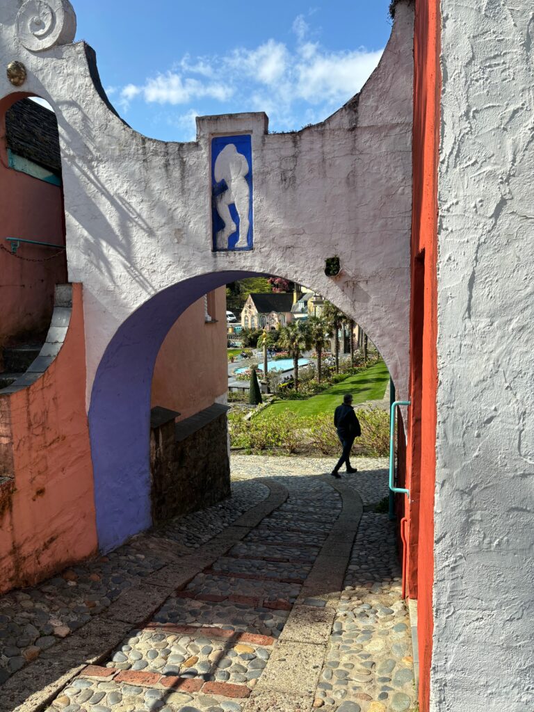 a person walking under a archway