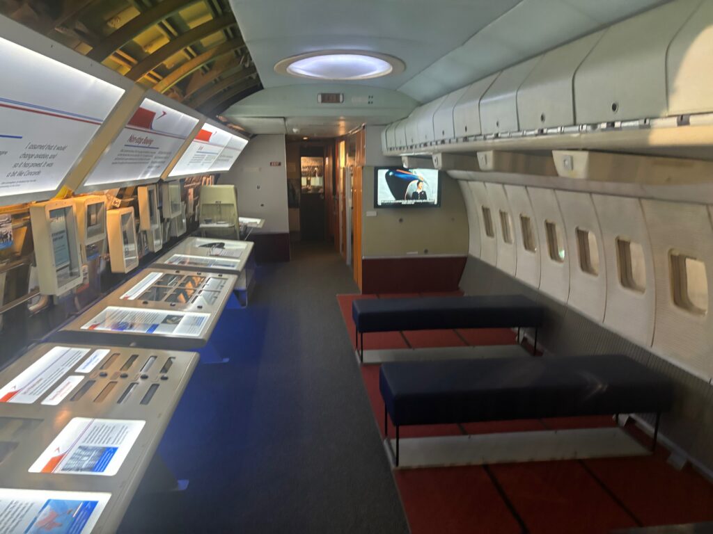 an airplane with many tables and a television