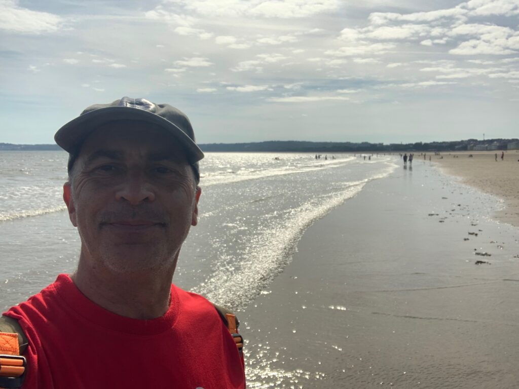 a man taking a selfie at the beach