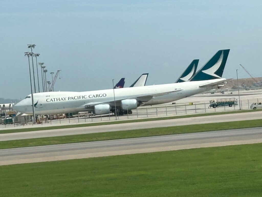 a large white airplane on a runway